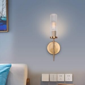Diamond Electricals Modern Gold Wall Sconce with clear cylindrical glass shade.